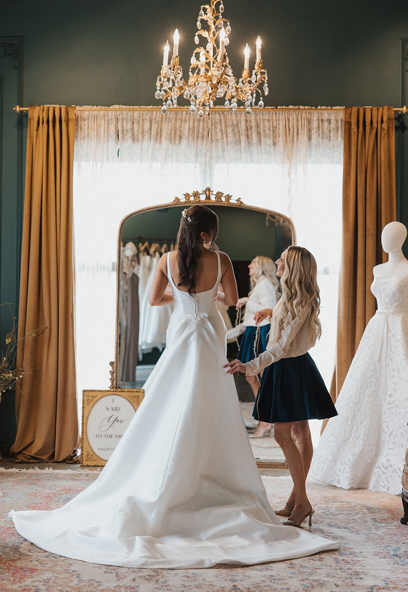 Bride trying on a wedding dress